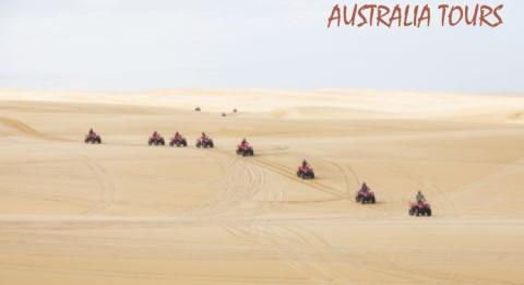 Sand Dune Adventures, Port Stephens Conference delegates enjoying a sand tune tour on quad bikes with Sand Dune Adventures, Port Stephens