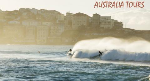 Bondi Beach, Sydney Surfers catching a morning wave at Bondi Beach in Sydney's eastern suburbs